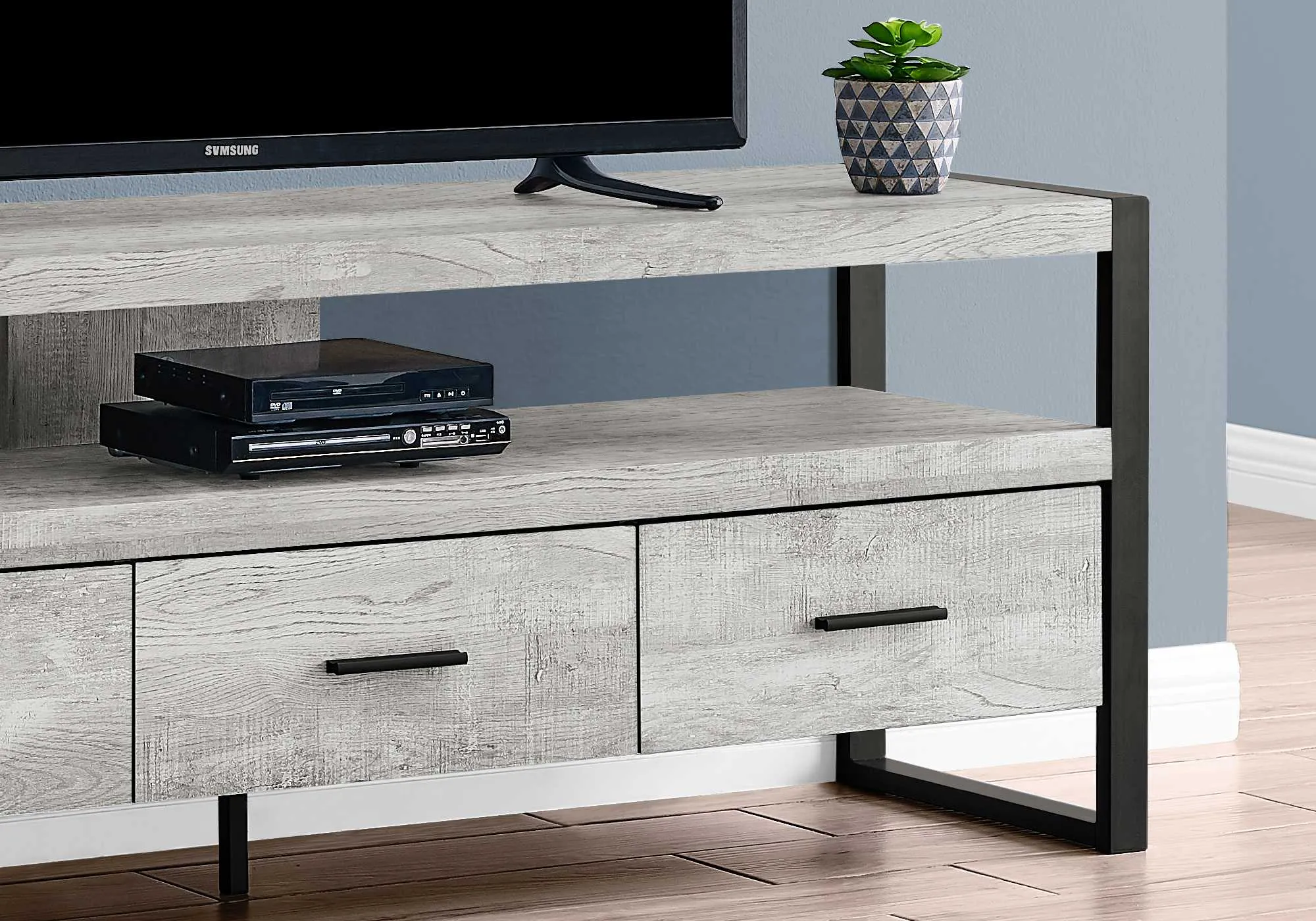 21.75" Grey Particle Board Hollow Core & Black Metal TV Stand With 3 Drawers By Homeroots