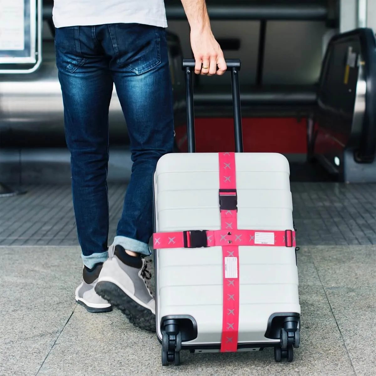 Bright pink luggage cross strap suitcase belts with baggage label tag